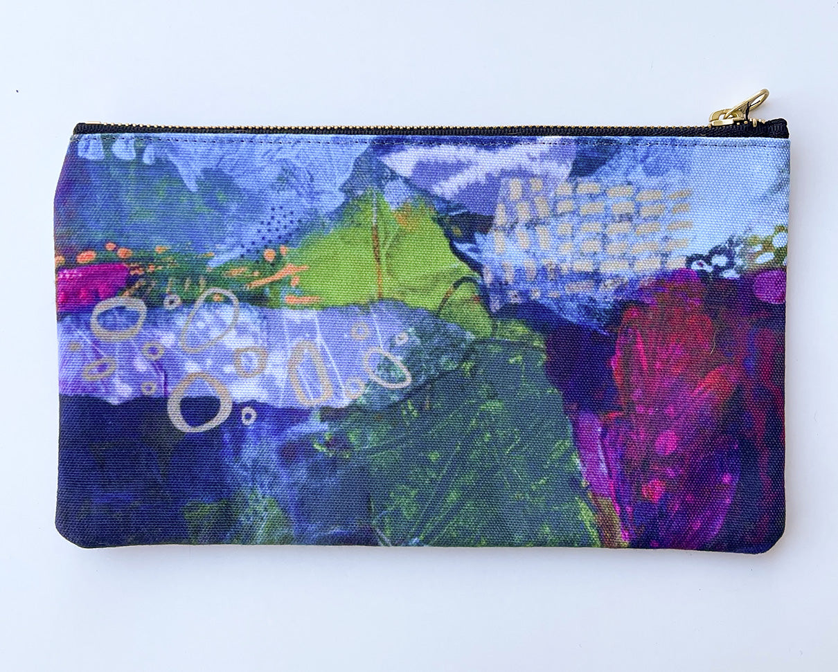 flat view of dark navy and magenta zipper pouch